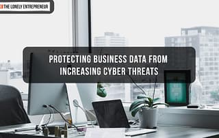 Computer screen with proper cybersecurity measures in place with a floor-to-ceiling window offering a city skyline view, symbolizing business security in an urban environment.